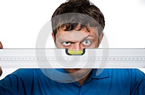 Man looks at the spirit level