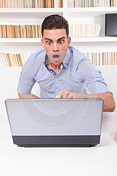 Man looks surprised at content on computer monitor failure