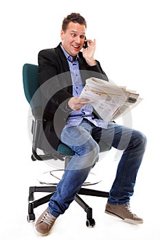 Man looks surprised while reading a newspaper