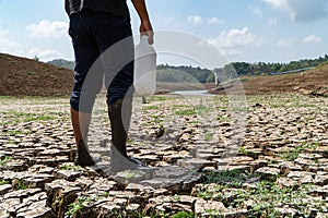 a man looks for water in the midst of the El-Nino climate disaster causing drought at the Palasari dam, Jembrana, Bali. The dam