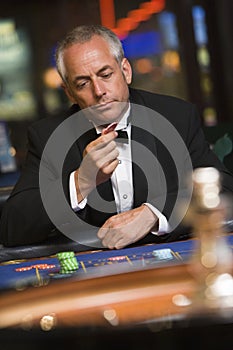 Man losing at roulette table