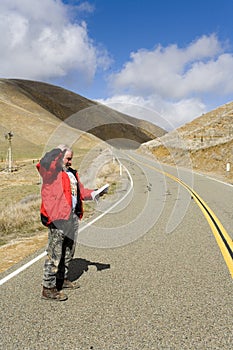 Man lost on a desolate road photo