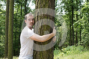 man love nature hug tree forrest save planet  climate change  increases levels of hormone oxytocin