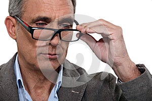 Man with lowered glasses