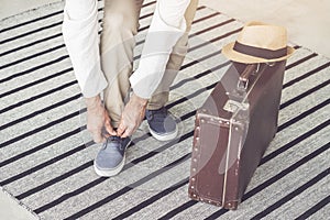 Man with luggage leaving home for a holiday