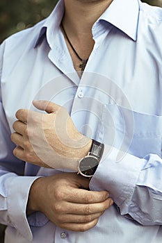 man in luxury blue shirt with watch