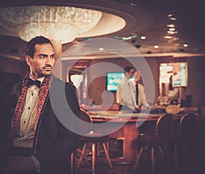 Man in luxury casino interior
