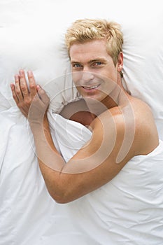 Man lying in bed