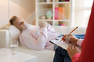 Man lying in couch during hypnotherapy