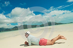 Man lying down contemplating the exotic view