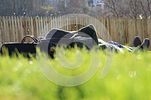 Man Lying on the Grass Above Waverley Mall in Edinburgh