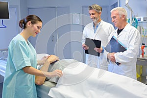 Man lying on hospital bed