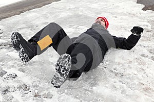 Man is lying on a icy way