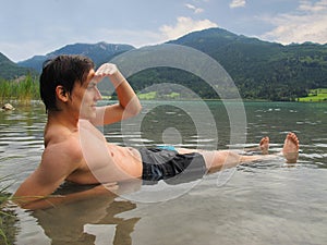 Man lying in lake