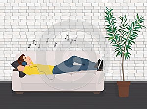 Man lying relaxing on the sofa couch and listen music.