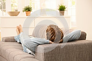 Man lying on sofa