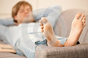 Man lying on sofa