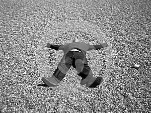 A man lying on stones