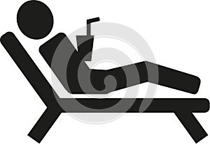 Man lying on sunbed pictogram