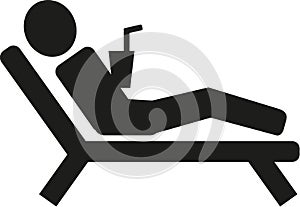 Man lying on sunbed pictogram photo