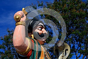 Man with machete statue