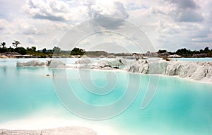 Man-made artificial clear blue lake Kaolin, mining ground holes covered by rain water.