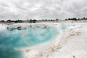 Man-made artificial lake Kaolin. Holes were formed covered by rain water, forming a clear blue lake.