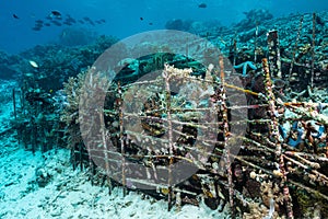 man-made artificial reef with metal struture and concrete photo