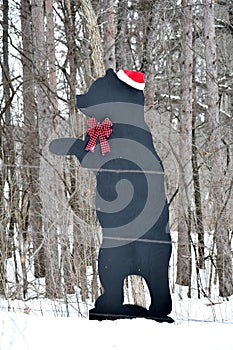 Man Made Black Bear in Forest  Santa Hat