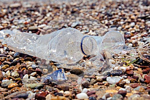 A man-made garbage in the sea: plastic bottles, glasses and other plastic
