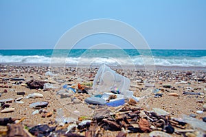 A man-made garbage in the sea: plastic bottles, glasses and other plastic