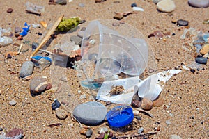 A man-made garbage in the sea: plastic bottles, glasses and other plastic