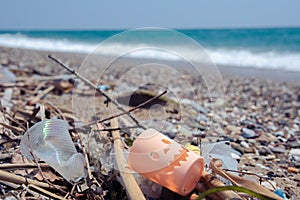 A man-made garbage in the sea: plastic bottles, glasses and other plastic