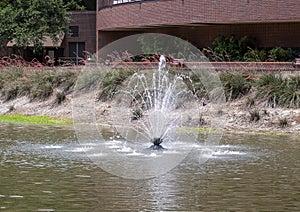 Man-made lake with one of two identical fountains at the Nortel Corporate Campus in Richardson, Texas.
