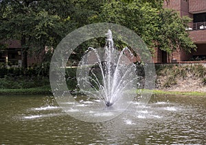 Man-made lake with one of two identical fountains at the Nortel Corporate Campus in Richardson, Texas.