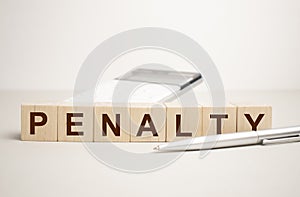 Man made word PENALTY with wood blocks