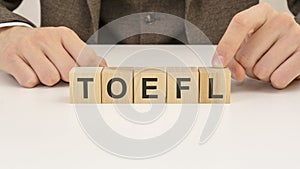 man made word toefl with wooden blocks