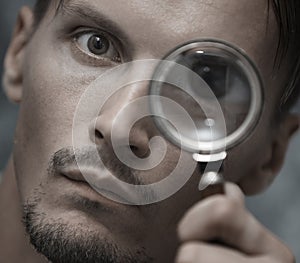 Man with magnifying glass