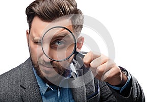 Man with magnifying glass on white background