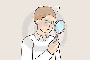 Man with magnifying glass works as private detective and tries to find small clues with loupe