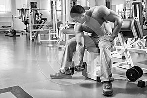 Man makes exercises dumbbells