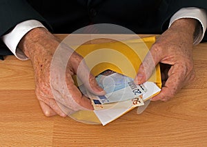 Man makes payment in Euros - with envelope photo