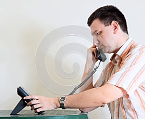 Man makes a phone call - dialing