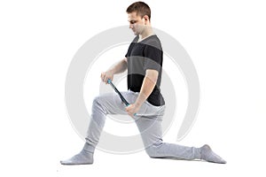 A man makes strengthening exercises for the body with special sports equipment. Self massage increases the body`s tone