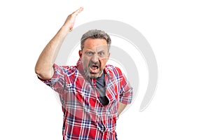 Man making angry gesture and yelling