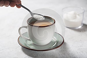 Man making coffee with milk and sweetener