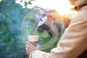 A man making coffee on nature