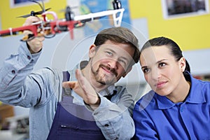 man making drone model with female apprentice