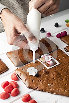 Man making a gingerbread house