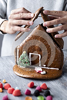 Man making a gingerbread house